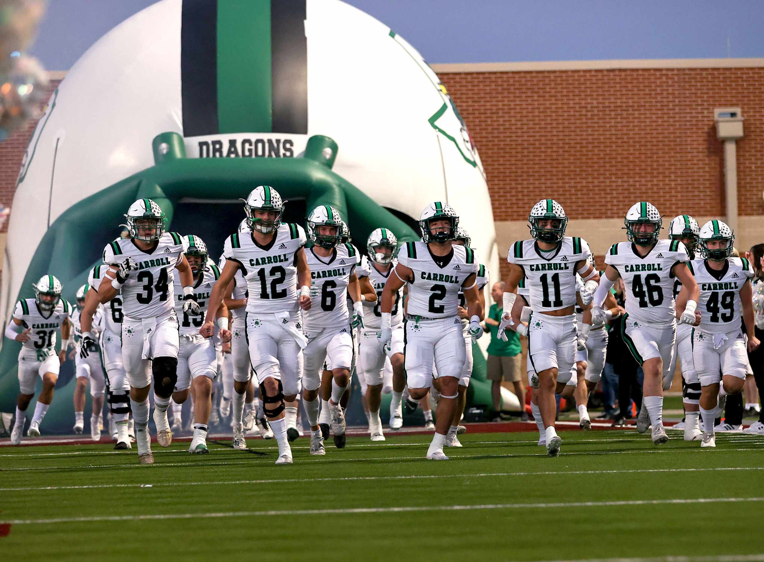 The Southlake Carroll Dragons enter the field to face Eaton in a District 4-6A high school...