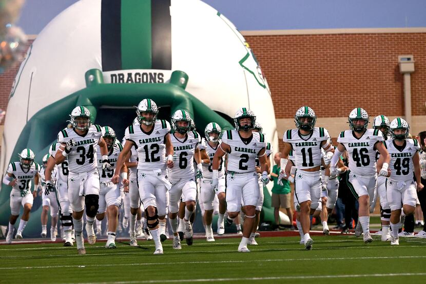 The Southlake Carroll Dragons enter the field to face Eaton in a District 4-6A high school...