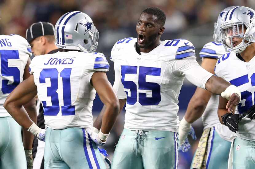 Dallas Cowboys middle linebacker Rolando McClain (55) talks to Dallas Cowboys free safety...