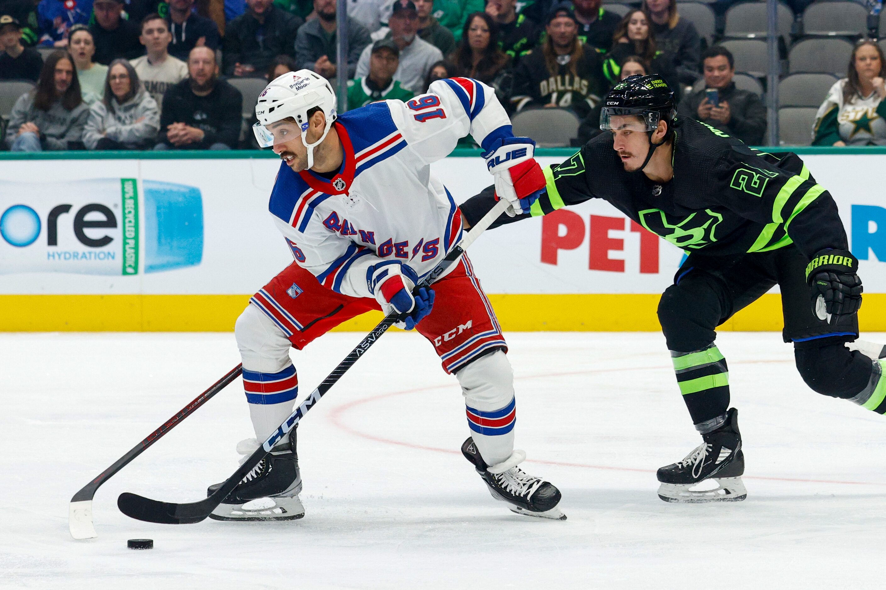 Dallas Stars left wing Mason Marchment (27) defends against New York Rangers center Vincent...