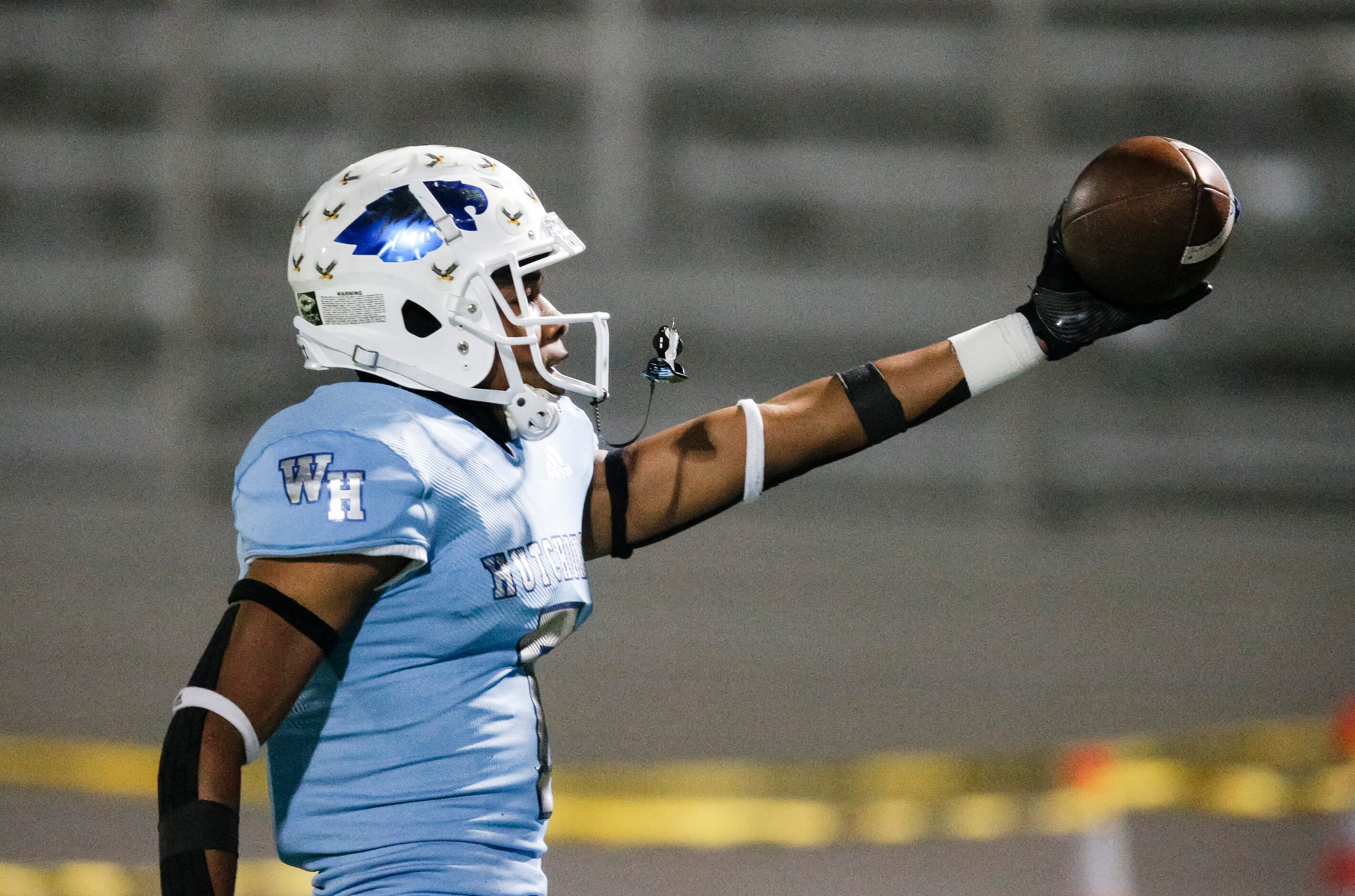 Wilmer-Hutchins senior wide receiver Jalin Moore (7) runs a pass in for a touchdown during...