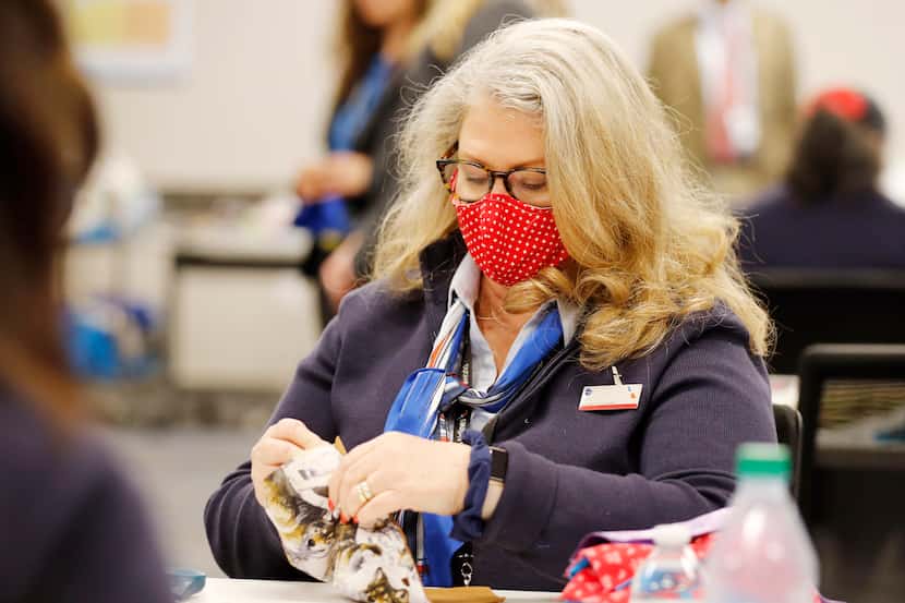 American Airlines employee Nancy Gergas works on making masks for employees at DFW...
