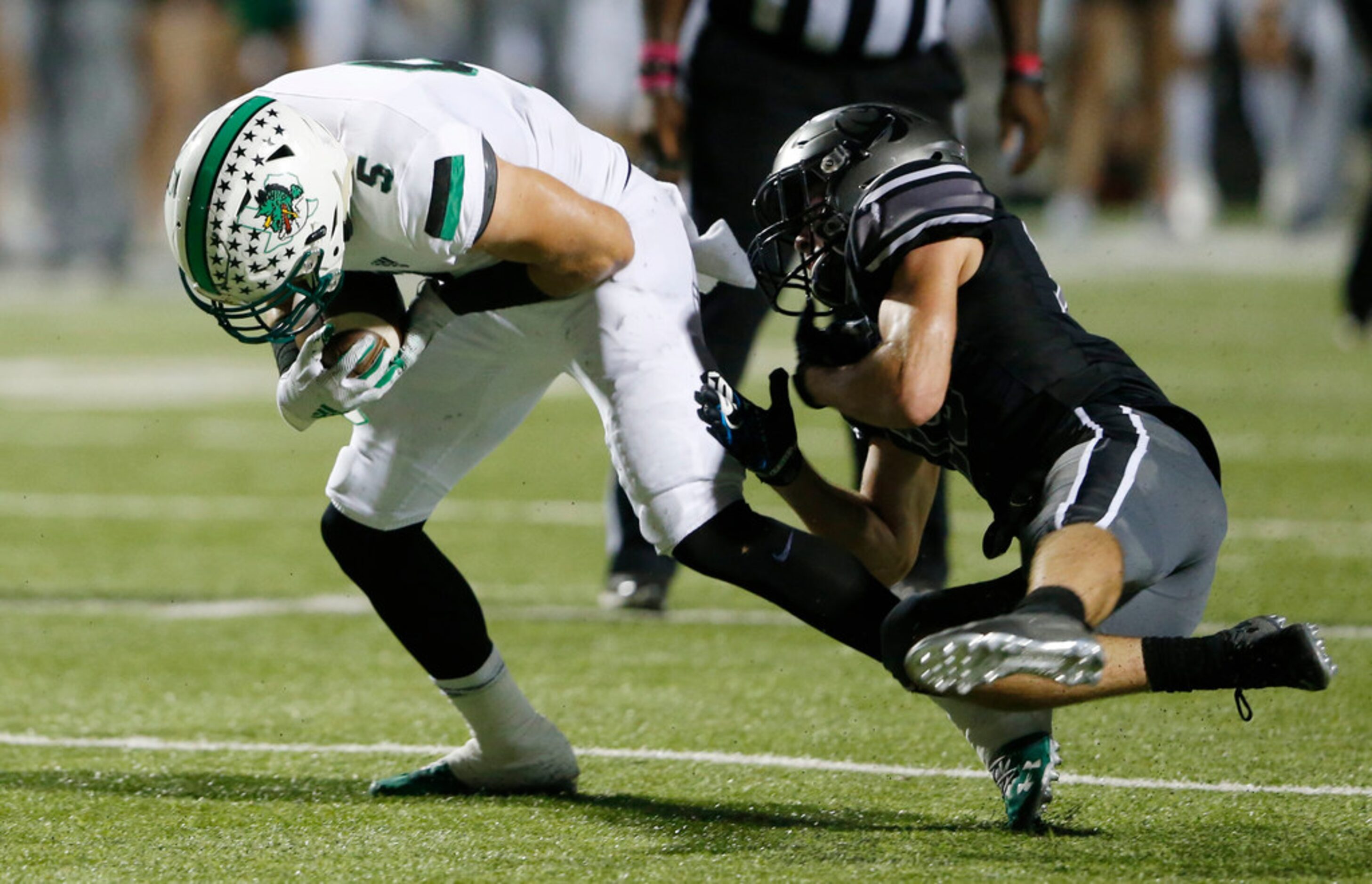 Southlake Carroll's Wills Meyer (5) breaks away from  Denton Guyer's Seth Meador (19) for a...