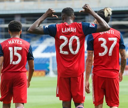 Roland Lamah points to the name on the back of his jersey against Portland Timbers. (3-24-18)