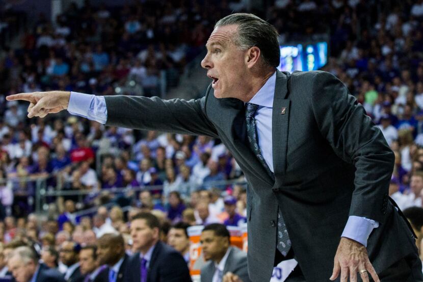 TCU Horned Frogs head coach Jamie Dixon points to a player on the court during the first...