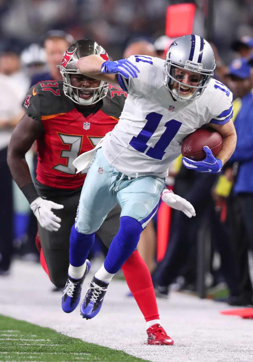 ARLINGTON, TX - DECEMBER 18:  Cole Beasley #11 of the Dallas Cowboys runs after catching a...