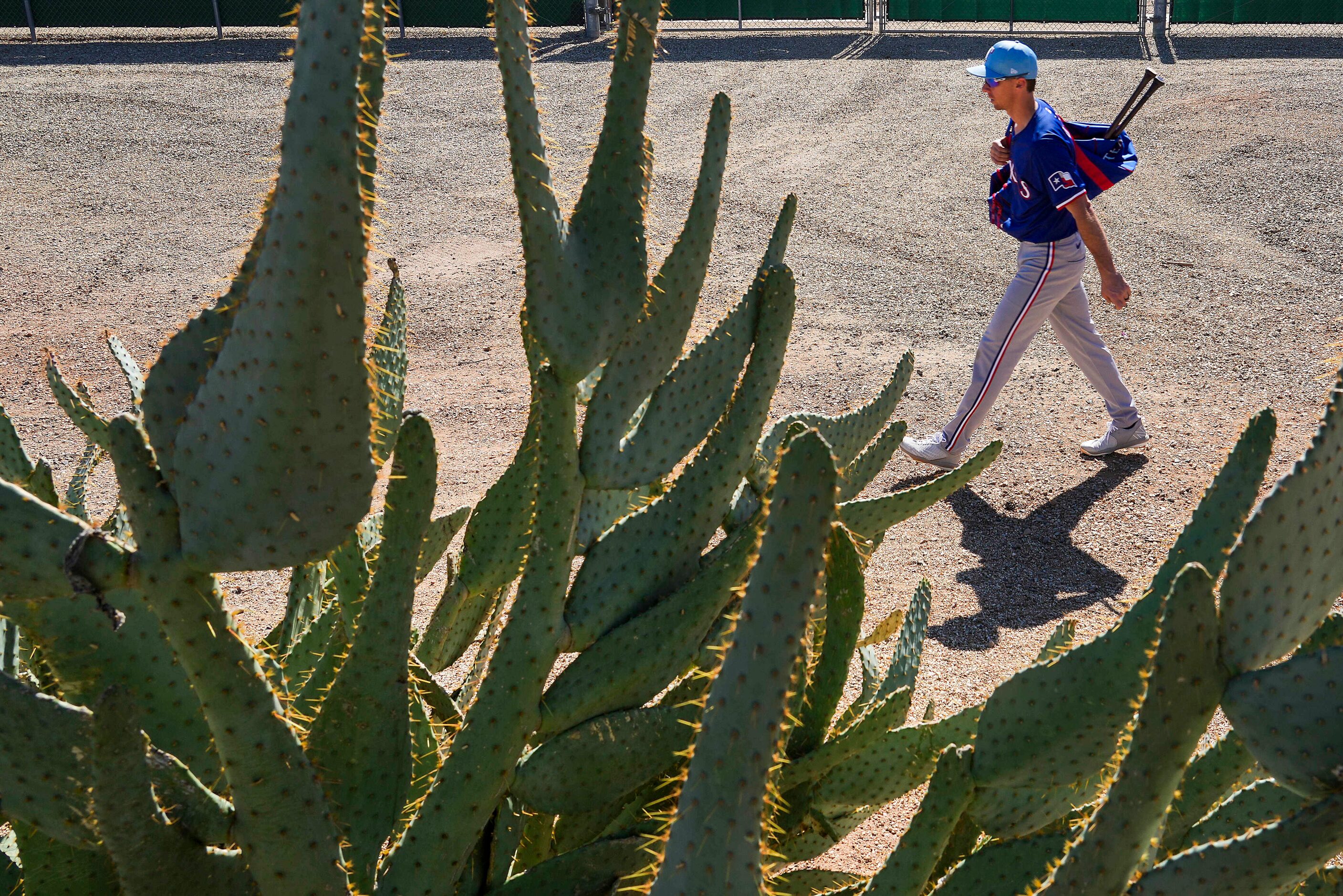 Texas Rangers infielder Matt Duffy heads back to the clubhouse after the first full squad...