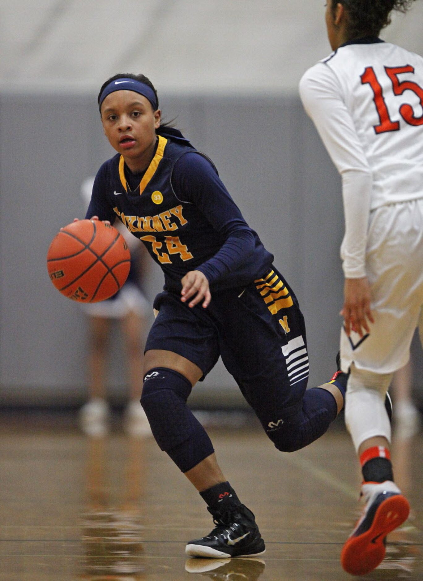 McKinney guard JaMiya Braxton (9) brings the ball up the court as she is defended in the...