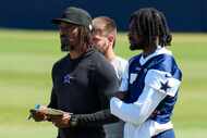 Dallas Cowboys defensive backs coach Al Harris watches with cornerback Trevon Diggs (7)...