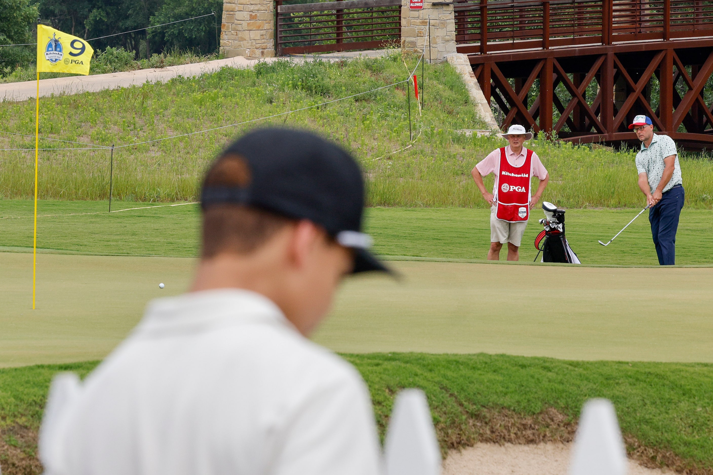 Neil Thompson of the United States hits onto the ninth green during the first round of the...