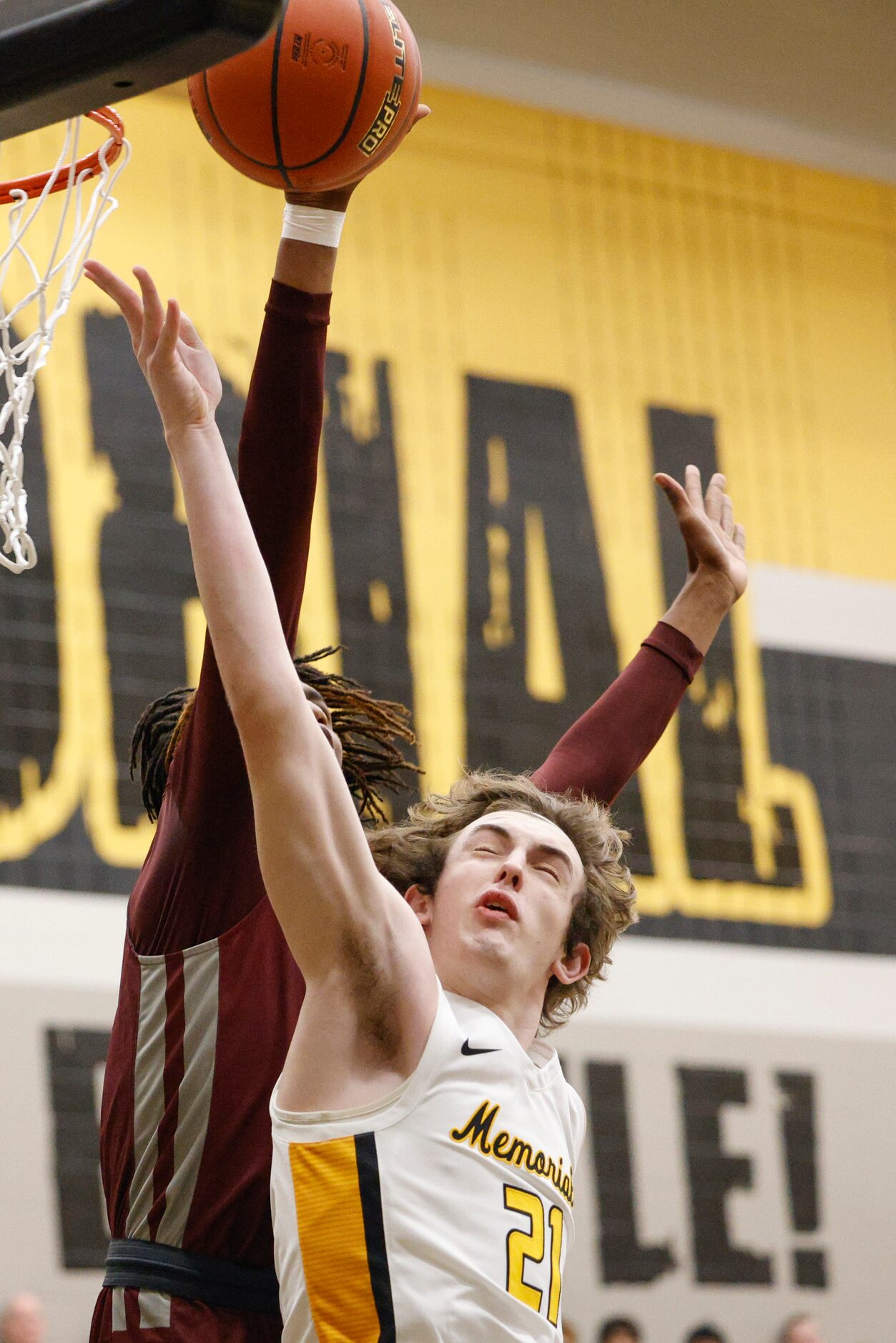 Plano forward Nikk Williams (22) blocks a shot from Frisco Memorial guard Drew Steffe (21)...