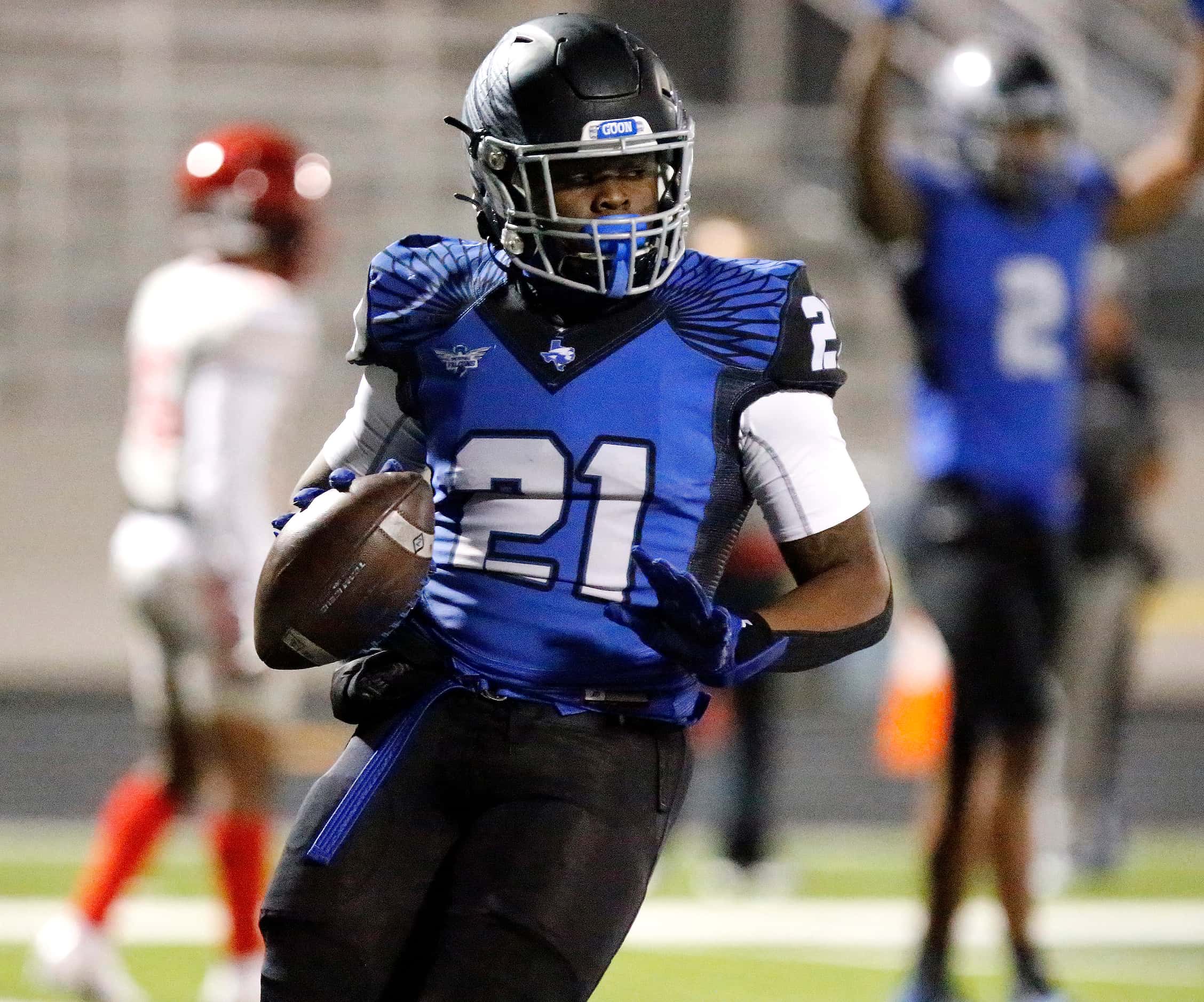 North Forney High School running back Ty Collins (21) scores a touchdown during the first...