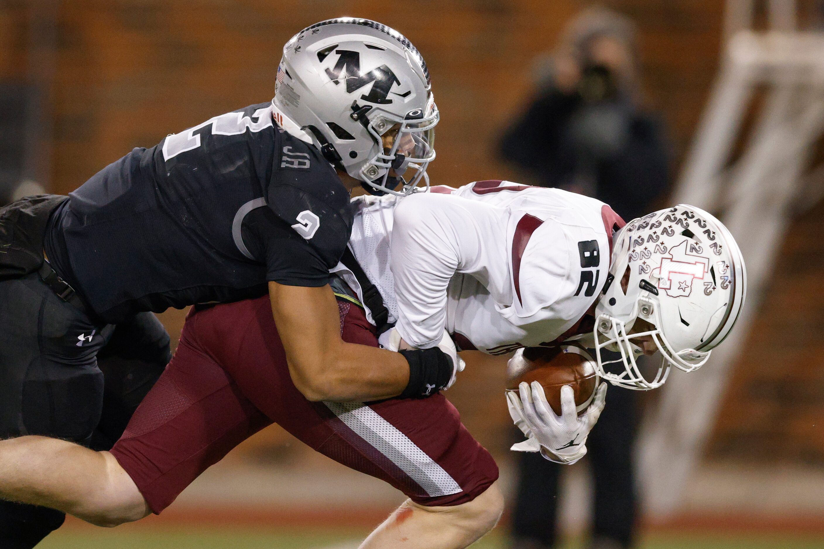 Arlington Martin defensive back Anthony Crenshaw Jr. (2)  tackles Lewisville tight end Lucas...