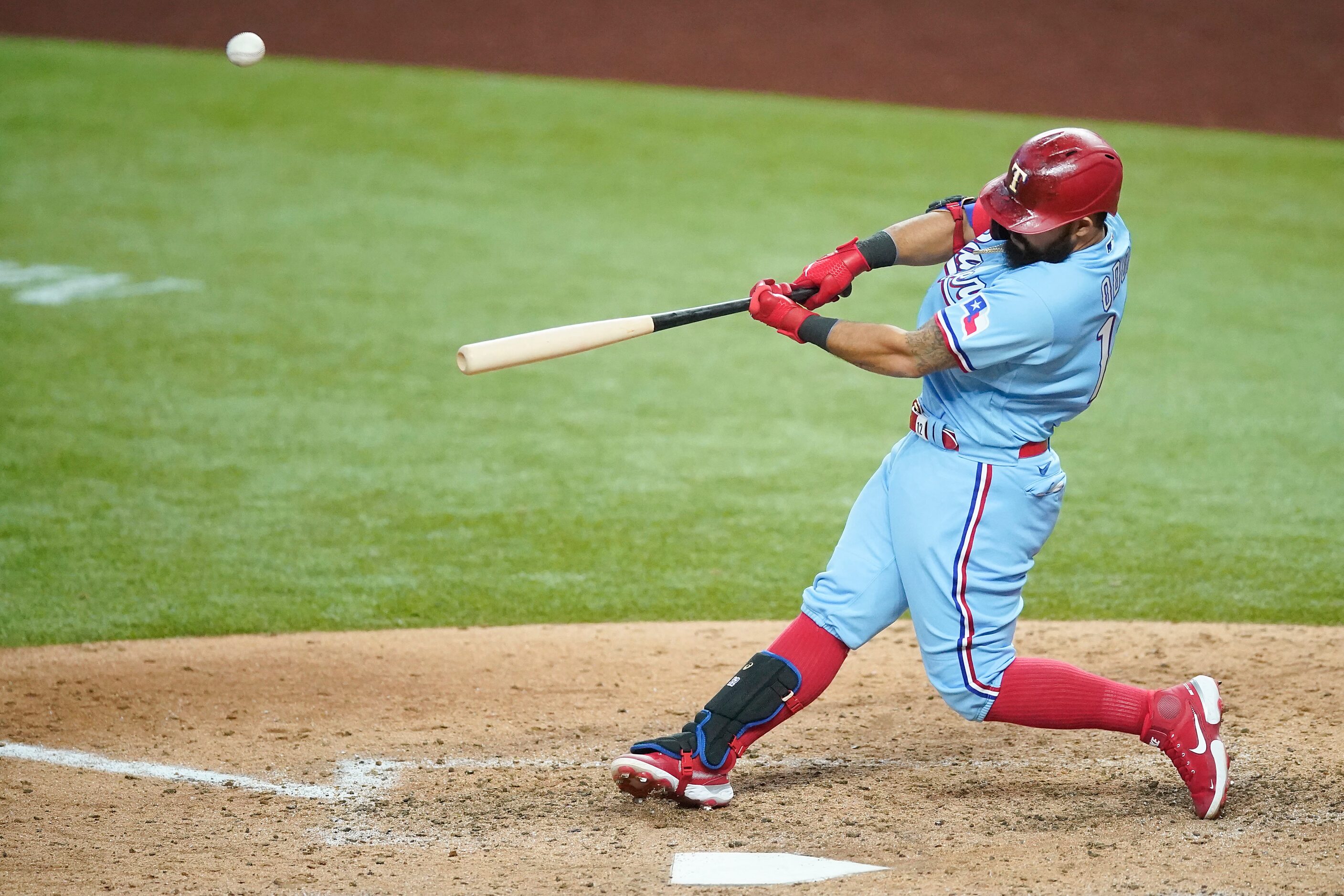 Texas Rangers second baseman Rougned Odor hits a 3-run home run during the sixth inning...