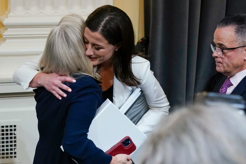 Cassidy Hutchinson, former aide to Trump White House chief of staff Mark Meadows, hugs vice...