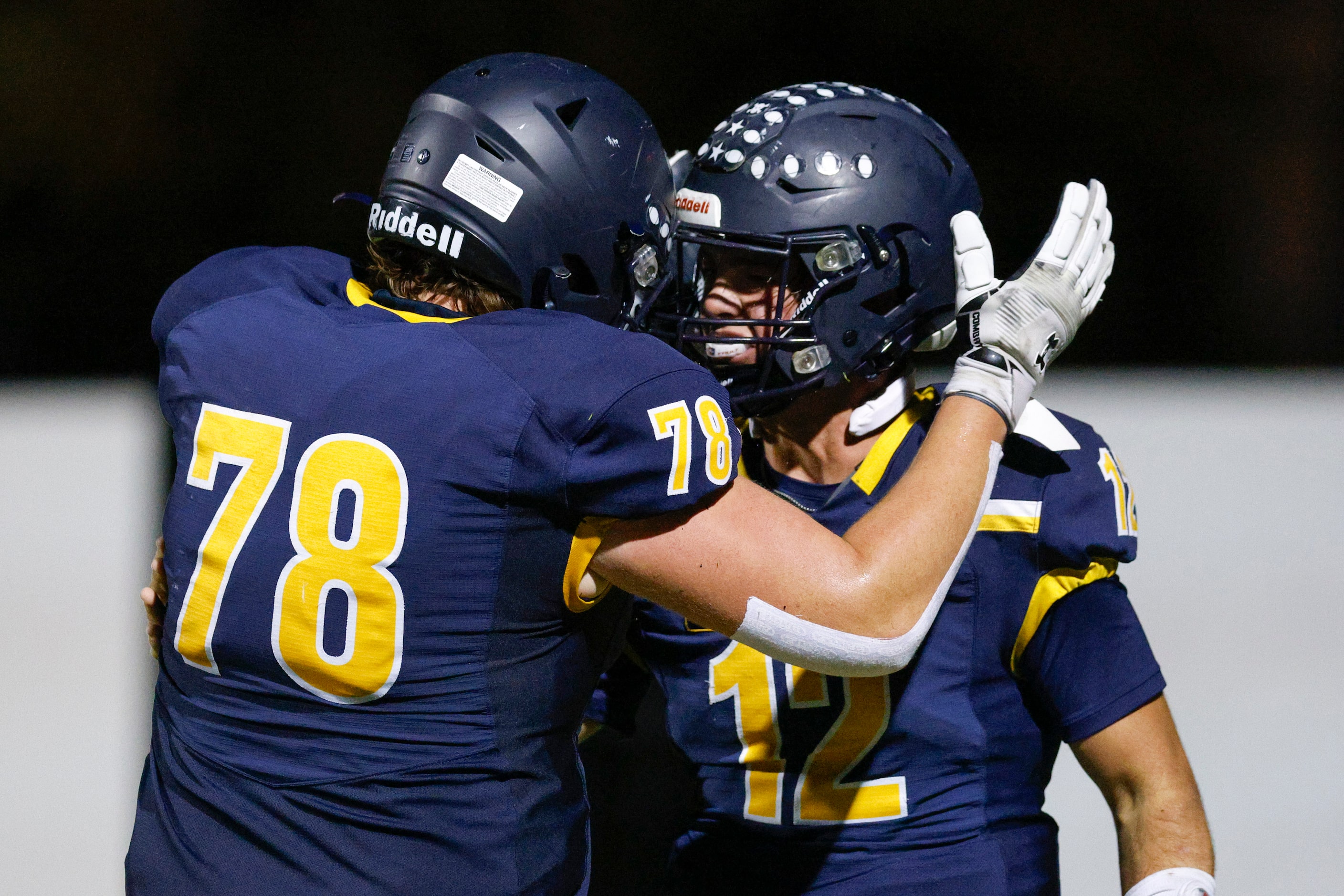 Highland Park quarterback Warren Peck (12) celebrates his touchdown reception with offensive...