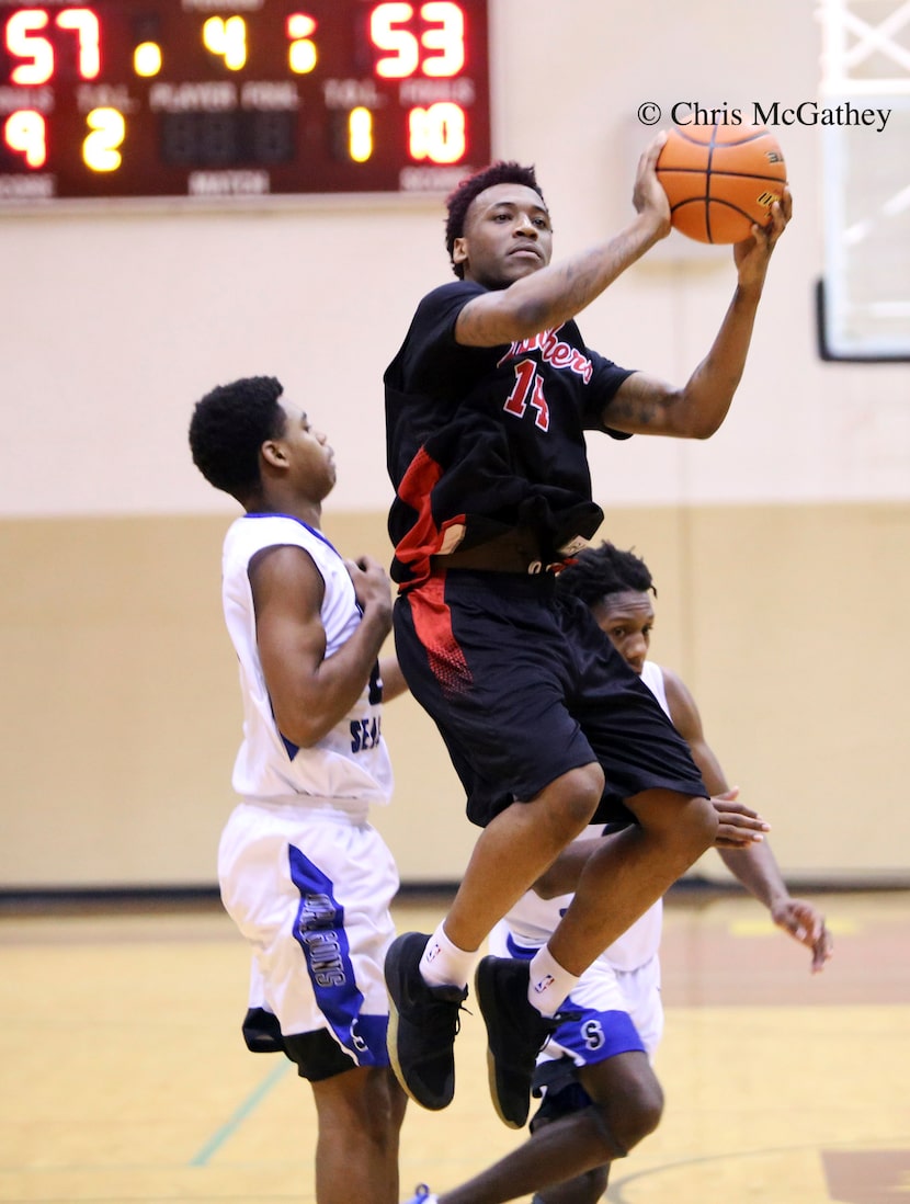 Sidney Bouvier Gilstrap-Portley (middle) played for the Hillcrest High basketball team...