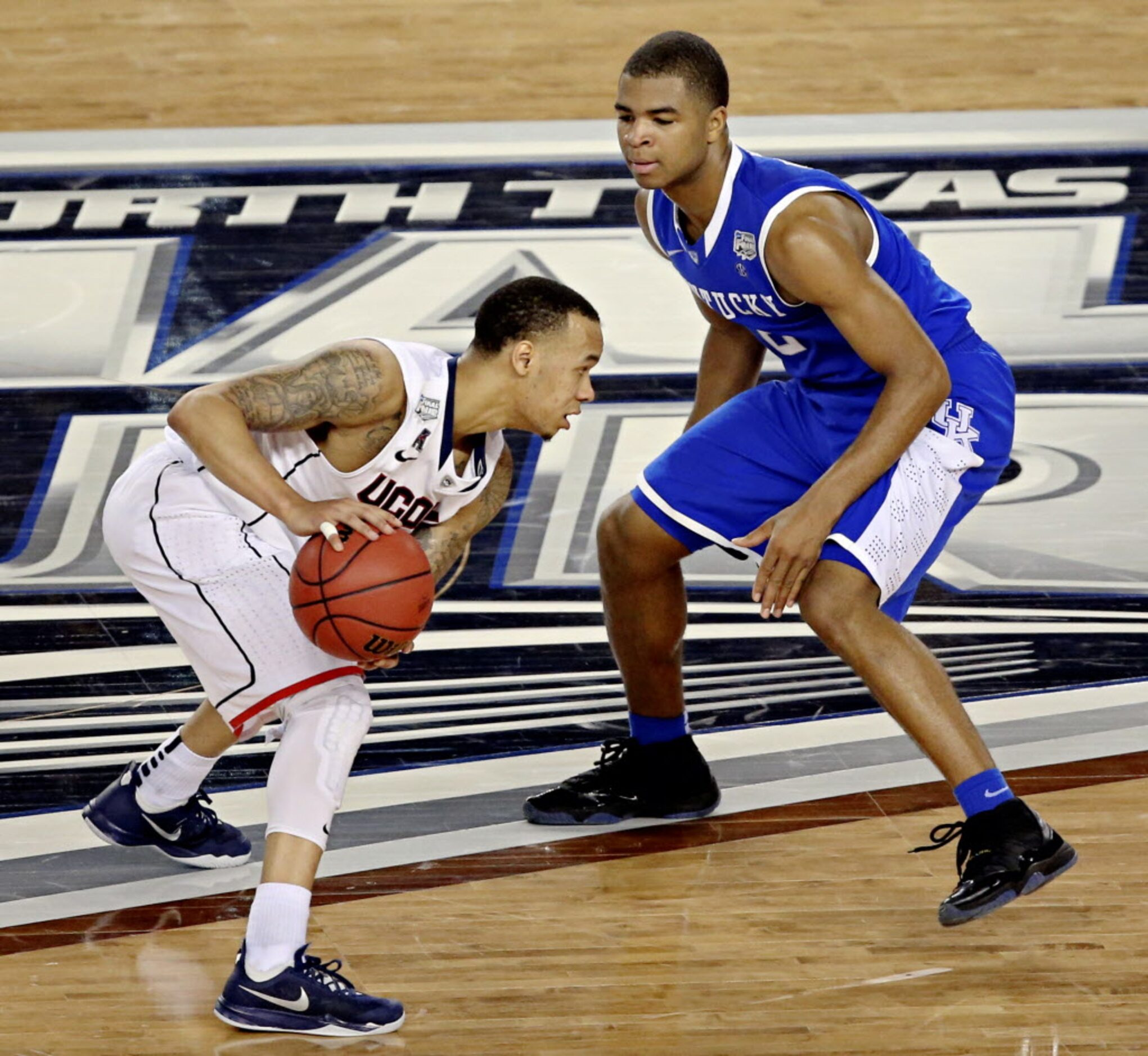 Connecticut Huskies guard Shabazz Napier squares off against Kentucky Wildcats guard Aaron...