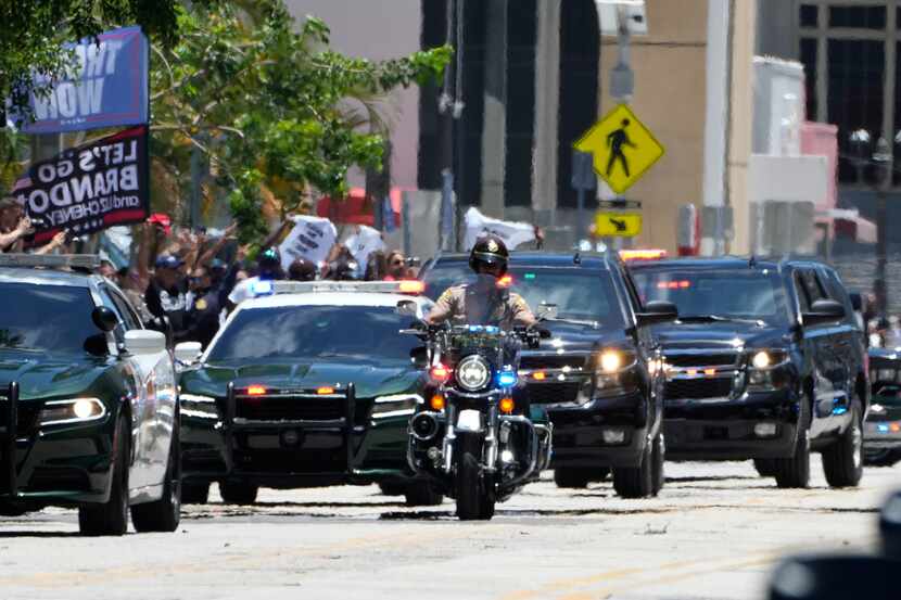 The motorcade carrying former President Donald Trump arrives near the Wilkie D. Ferguson Jr....