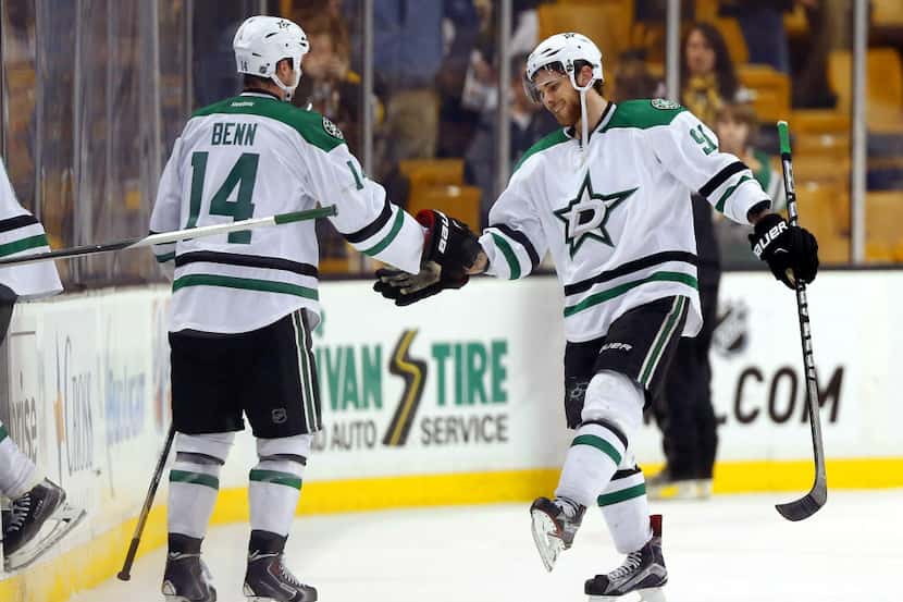 Dallas Stars' Tyler Seguin and Jamie Benn (14) celebrate after their 5-3 win over the Boston...