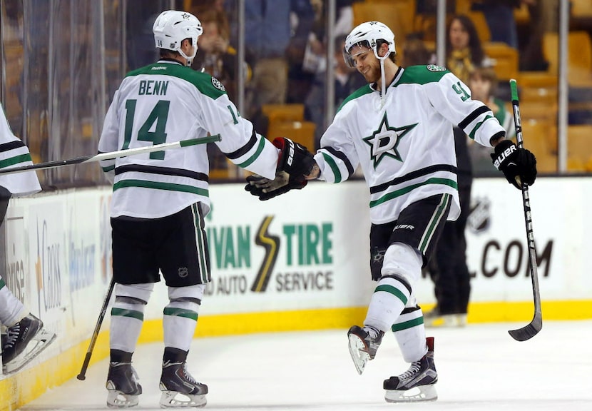 Dallas Stars' Tyler Seguin and Jamie Benn (14) celebrate after their 5-3 win over the Boston...