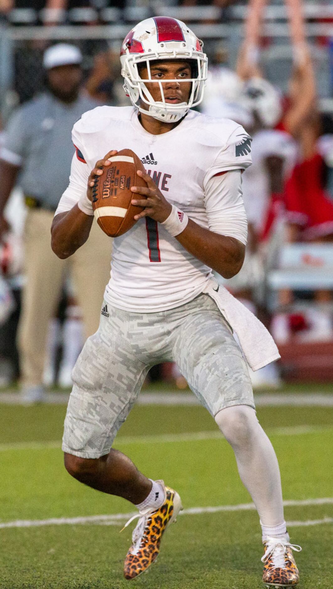 Bishop Dunne quarterback Simeon Evans (1) looks to make a pass during a game against All...