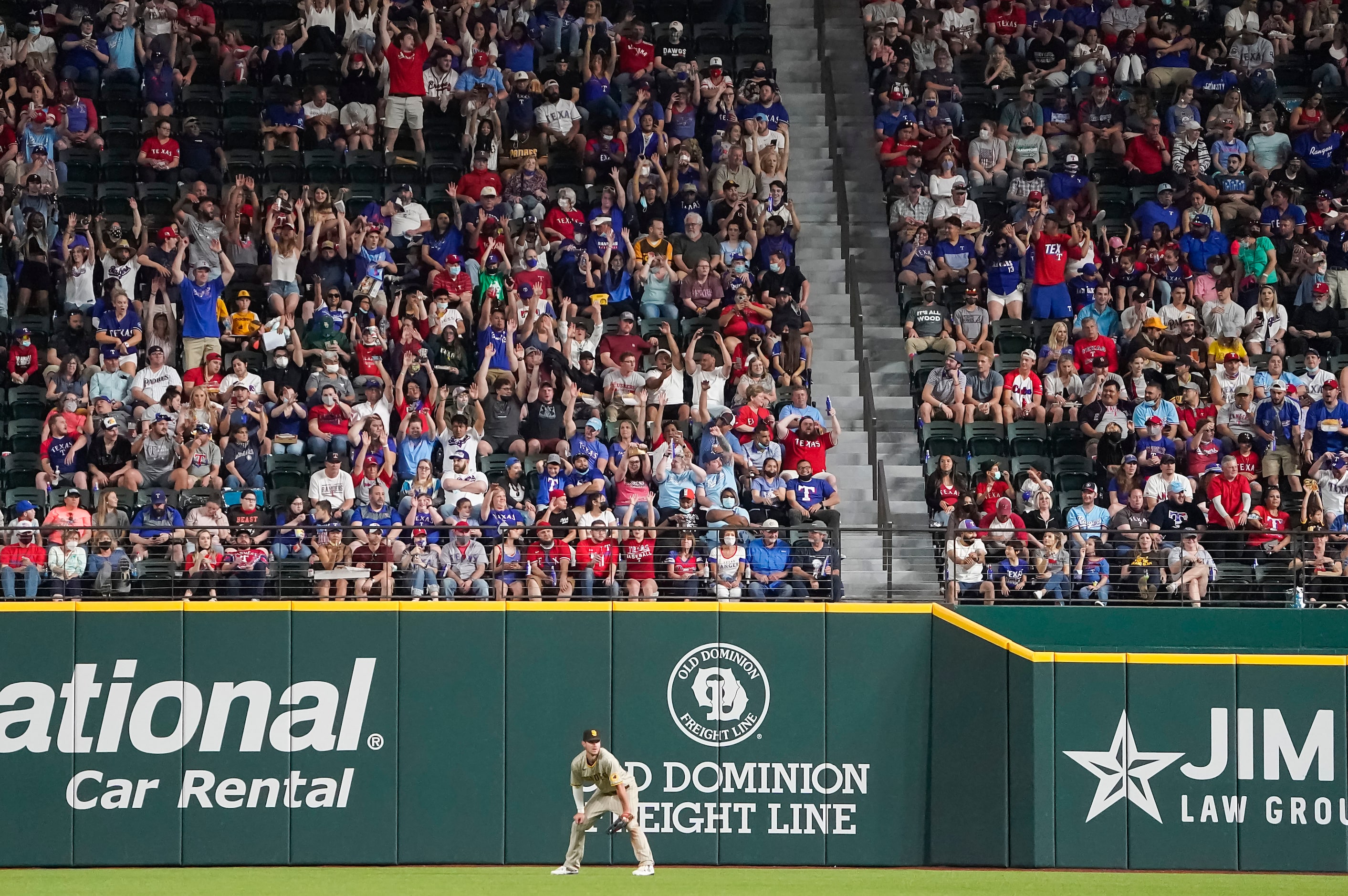 Fans do the wave behind San Diego Padres right fielder Wil Myers during the sixth inning...