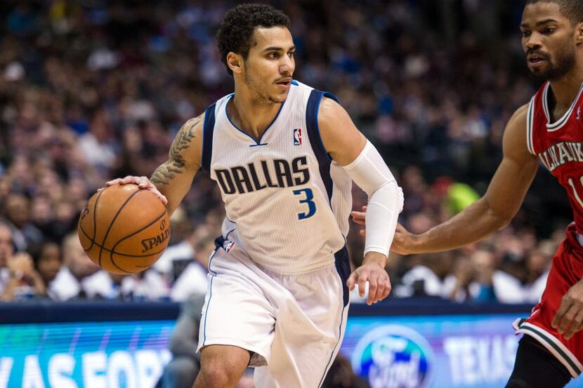 Dec 14, 2013; Dallas, TX, USA; Dallas Mavericks point guard Shane Larkin (3) dribbles the...