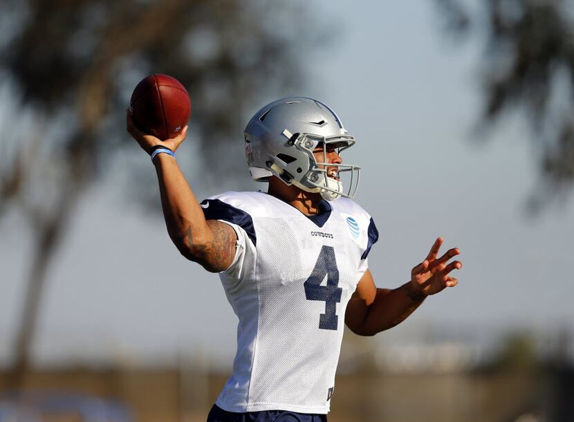 Dallas Cowboys quarterback Dak Prescott (4) fires a pass from the pocket during afternoon...