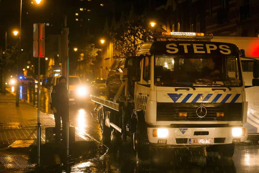 
A car was towed during a police raid in Brussels’ Molenbeek district on Saturday in...