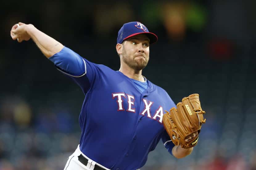 Texas Rangers starting pitcher Colby Lewis (48) pitches in the first innning of play in an...