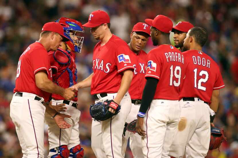 Texas Rangers starting pitcher Chi Chi Gonzalez (21) leaves the game in the fifth inning...