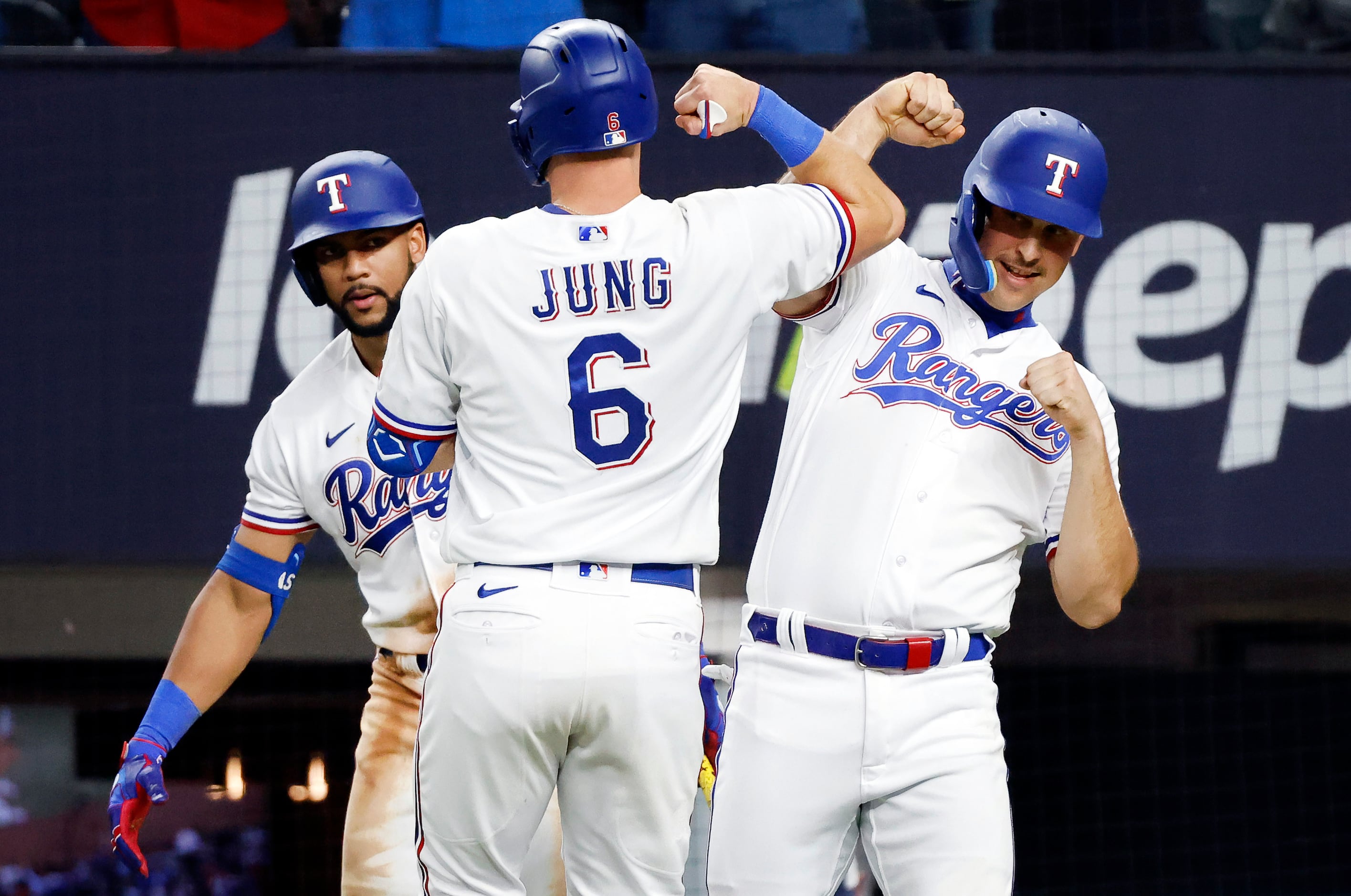 Texas Rangers' Josh Smith (47) is congratulated by Josh Jung after