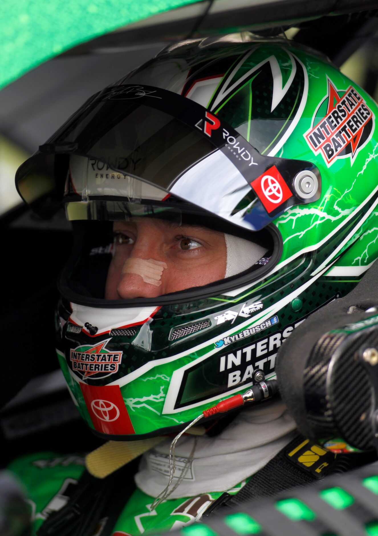 Driver Kyle Busch focuses moments before the start of the race from behind the wheel of his...