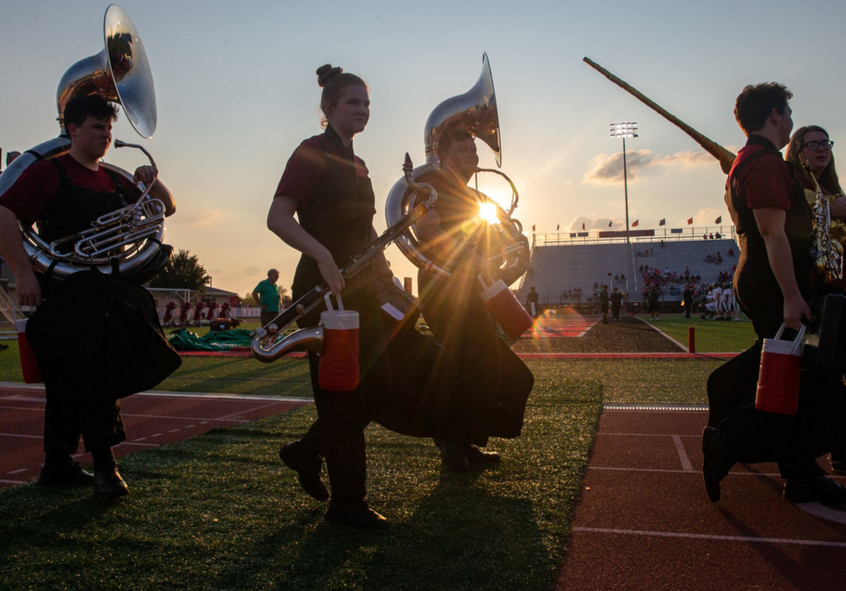 Lovejoy High School band members prepare for the football game between Lebanon Trail High...