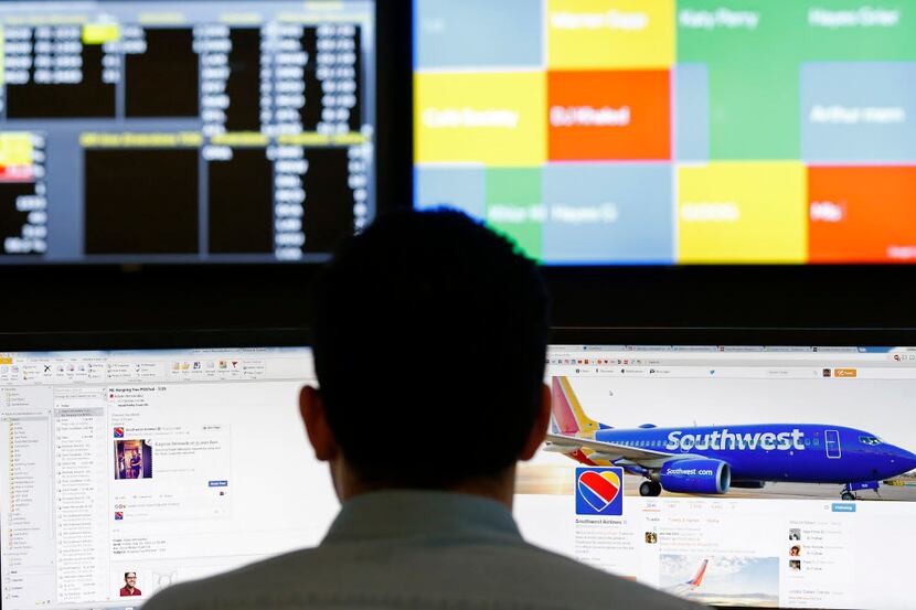 Social business specialist Adam Hernandez monitors the Southwest Airlines twitter account on...