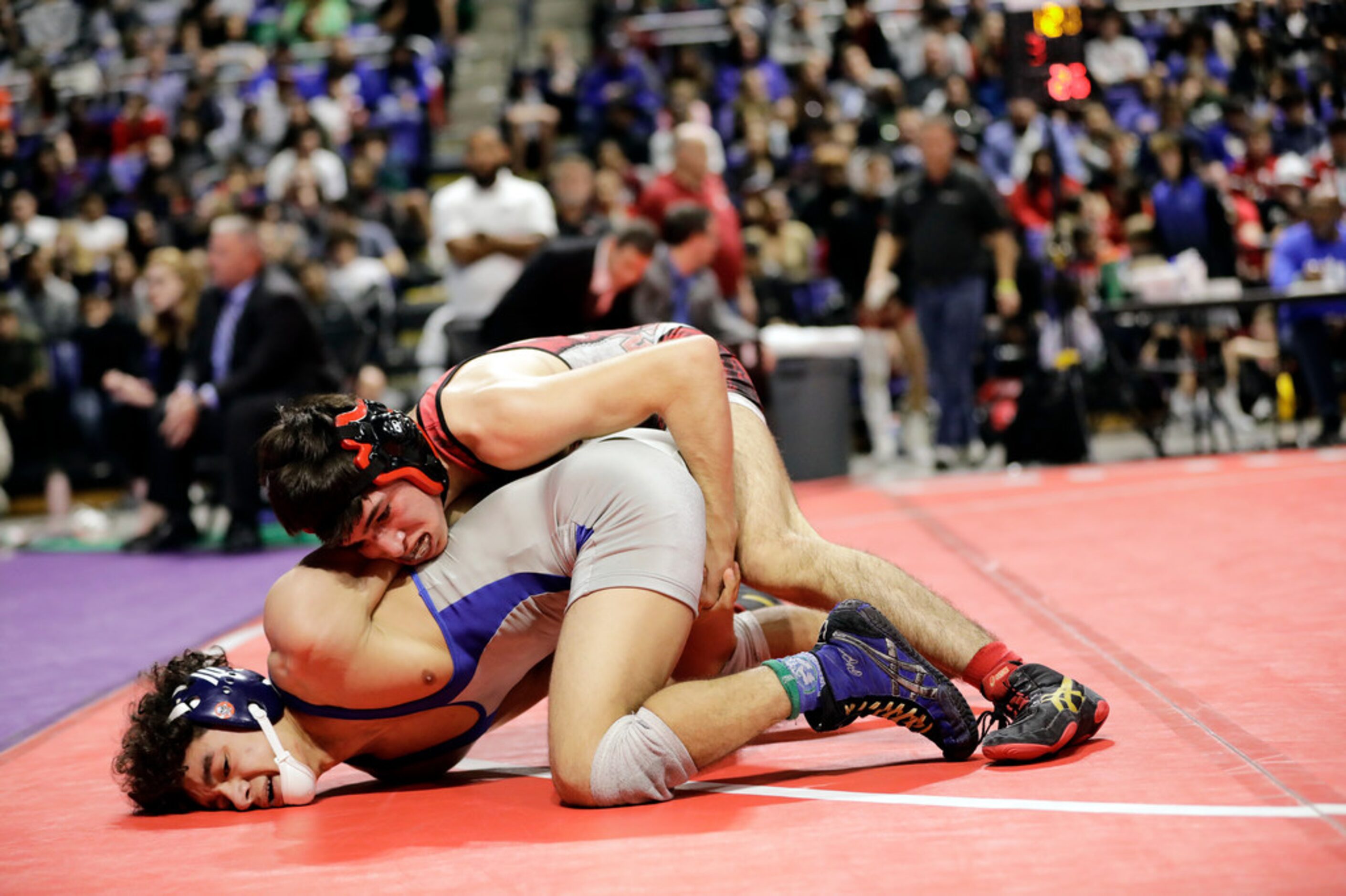 Dominic Chavez of Arlington Martin wrestles during the UIL Texas State Wrestling...