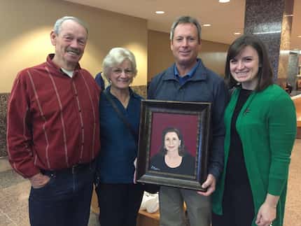 Joe Brown, Lorraine Brown, Don Martin and Caitlin Martin-Linduff with a painting of Kellie...