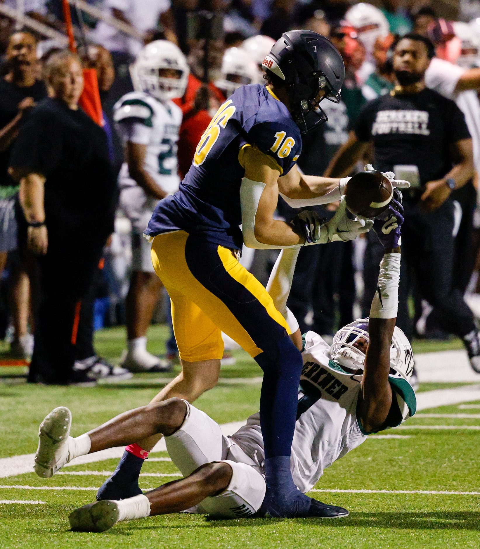 Highland Park wide receiver Parker Thompson (16) catches a pass over Richardson Berkner...