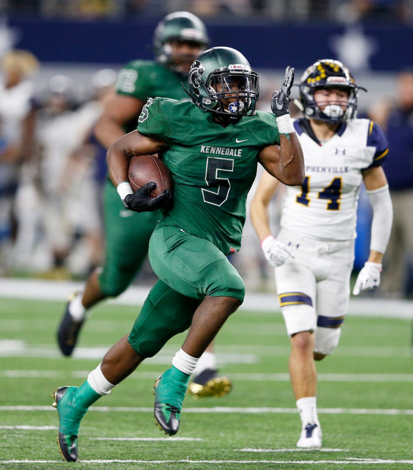 Kennedale's Jaden Knowles (5) runs up the field for his second touchdown in a game against...