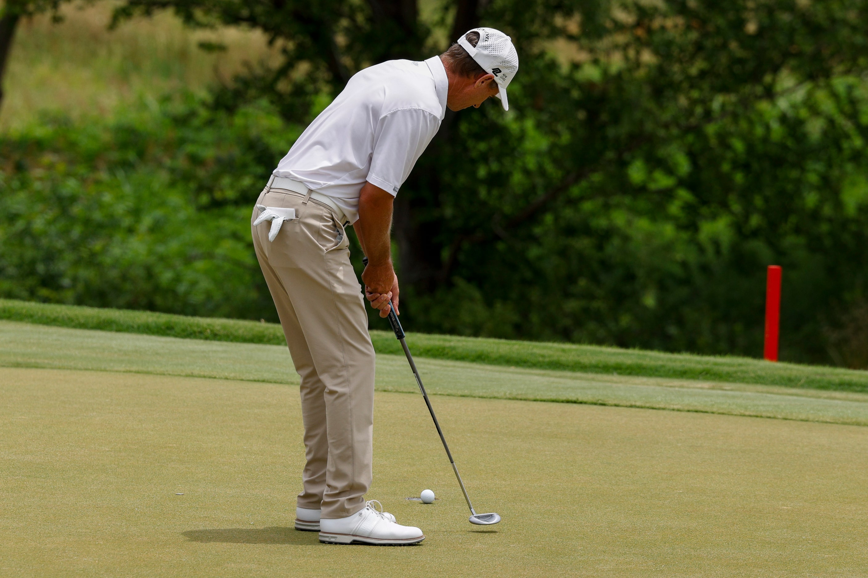 Steven Alker of New Zealand putts for birdie on the 18th hole during the first round of the...