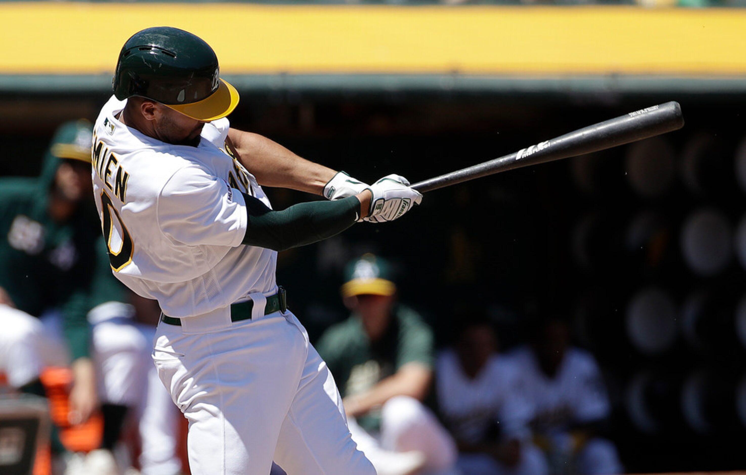 Oakland Athletics' Marcus Semien hits a three-run home run against the Texas Rangers during...