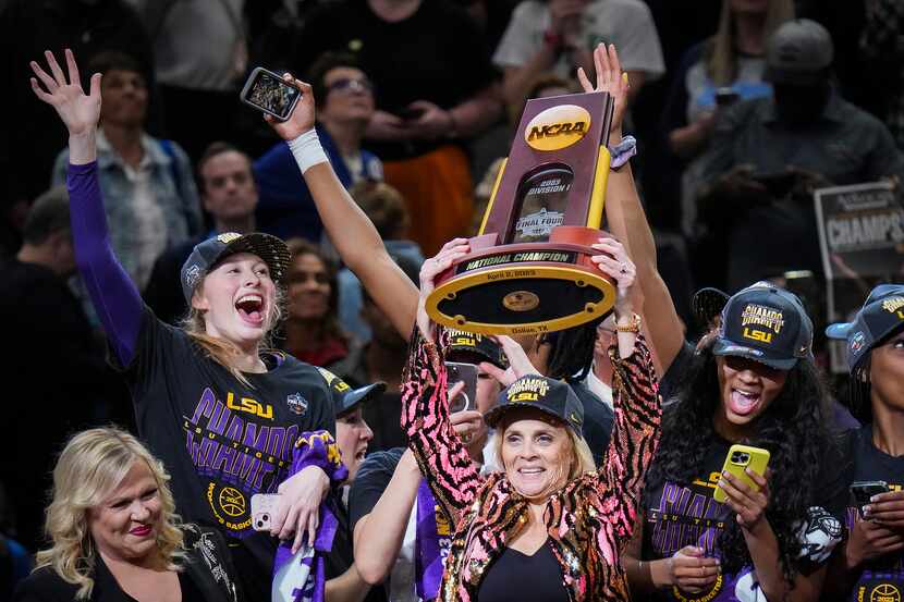 LSU head coach Kim Mulkey raises trophy a victory over Iowa in the NCAA Women's Final Four...