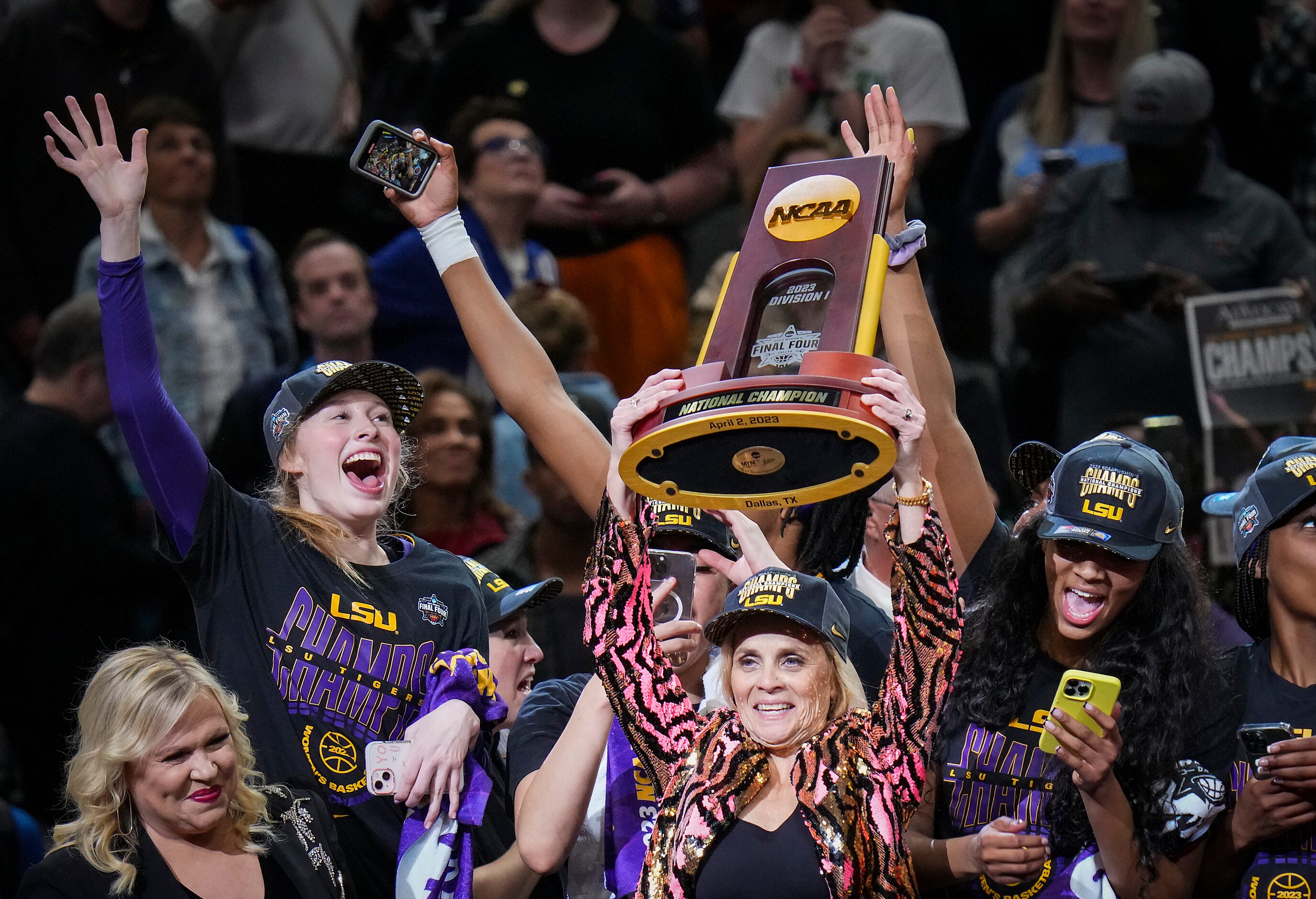 LSU head coach Kim Mulkey raises trophy a victory over Iowa in the NCAA Women's Final Four...