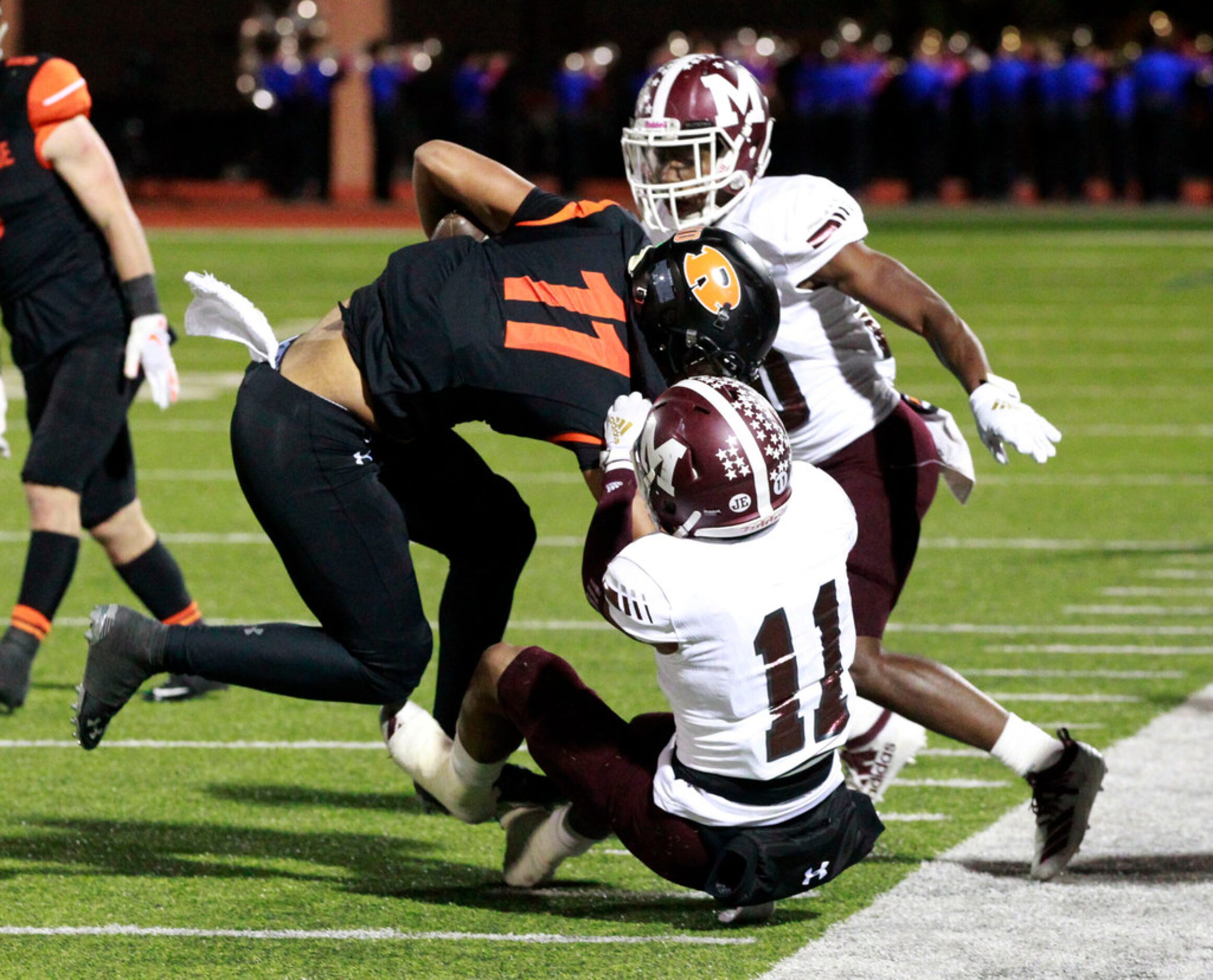 Mesquite defender Dewayne Adams (11) pulls down Rockwall WR Jaxon Smith-Njigba  (11) during...