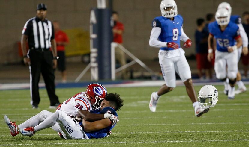 Allen's Carson Schlleker (6) loses his helmet as he's tackled by Evangel Christian Academy's...