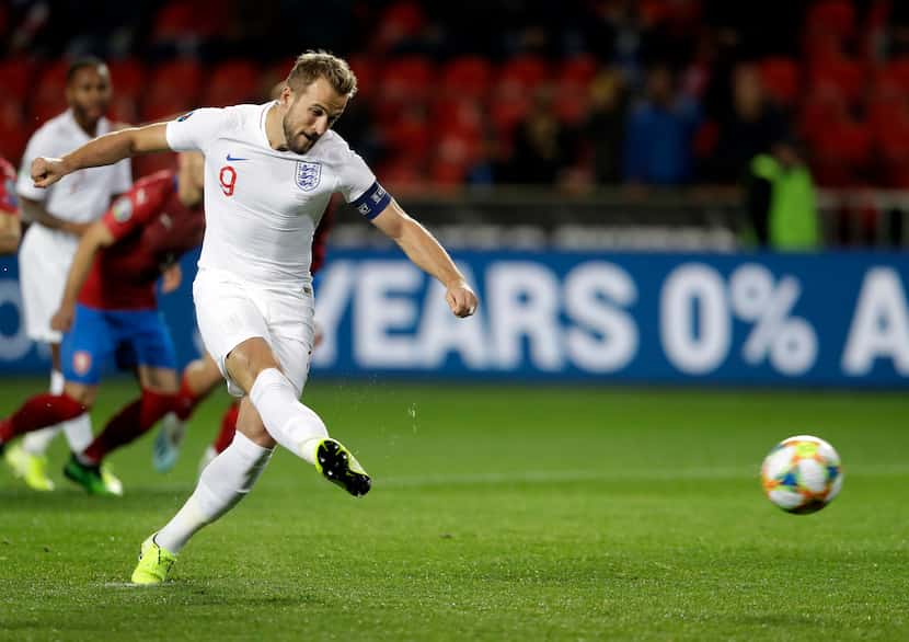 England's Harry Kane scores his side's opening goal from the penalty spot during the Euro...