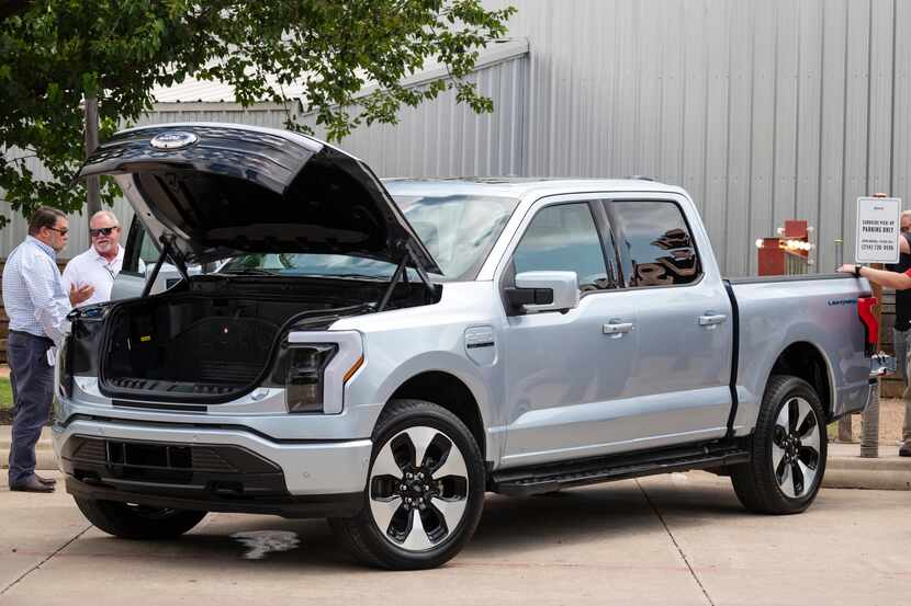 The new electric Ford F-150 Lightning truck was on display during an event for auto dealers,...