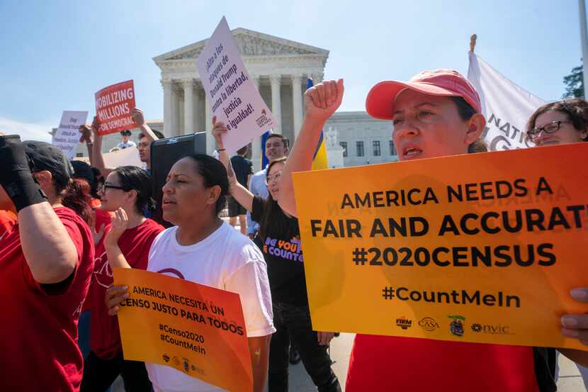 In this June 27, 2019, file photo, demonstrators gather at the Supreme Court on Capitol Hill...