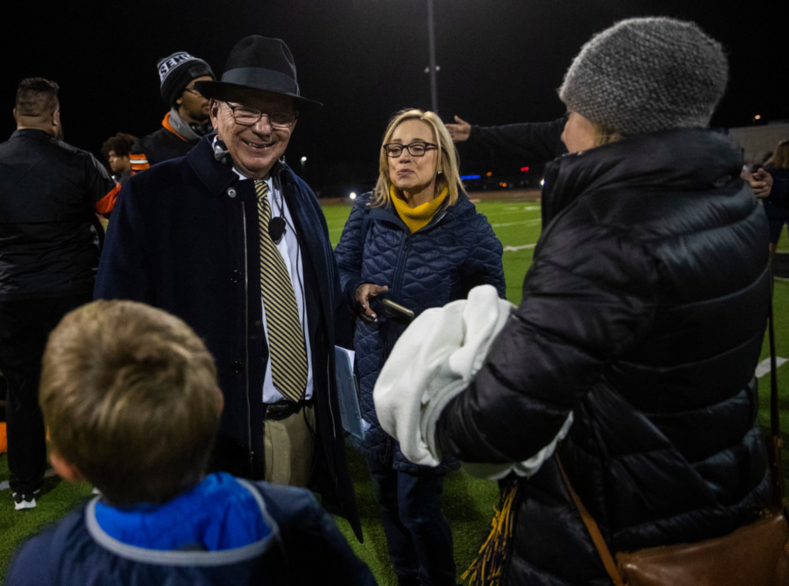 Highland Park head coach Randy Allen smiles while he chats with family after a 42-35 win...